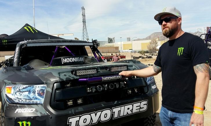 © Reuters. Desert racer BJ Baldwin stands in front of the Monster Energy Truck at the Mint 400 also known as the ÒGreat American Off-Road RaceÓ in Las Vegas