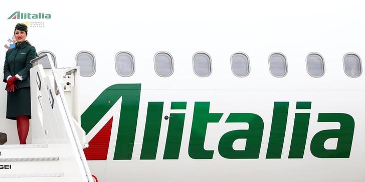 © Reuters. Alitalia's flight attendant is seen at the Leonardo da Vinci-Fiumicino Airport in Rome