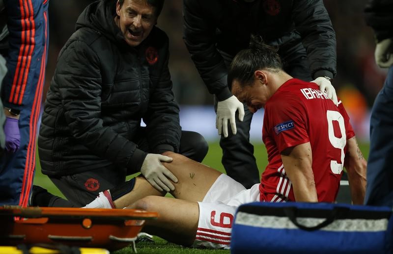 © Reuters. Manchester United's Zlatan Ibrahimovic receives medical attention after sustaining an injury