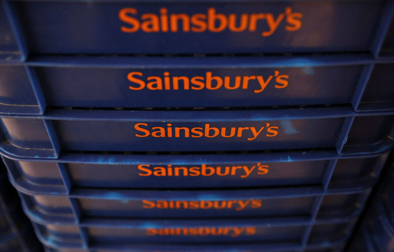 © Reuters. FILE PHOTO - Shopping baskets are displayed at a Sainsbury's store in London