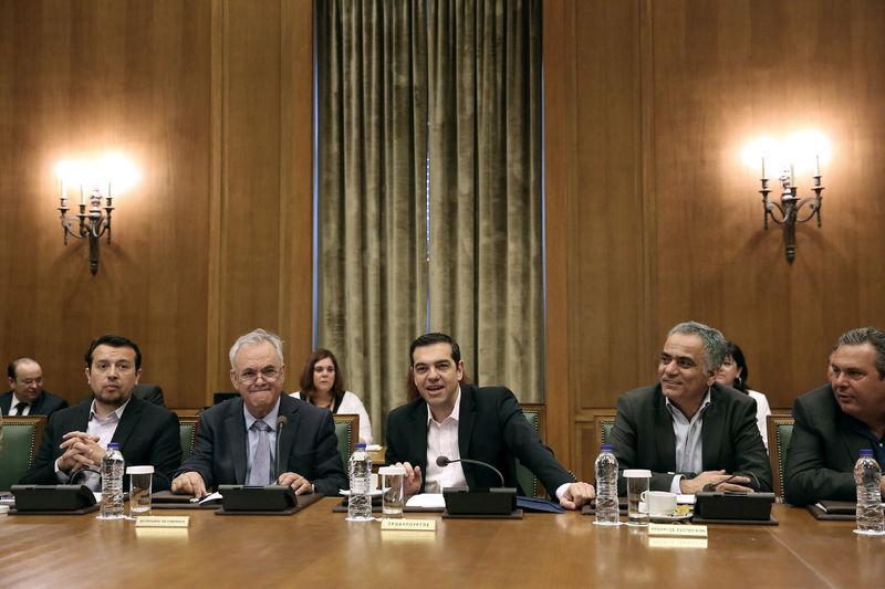 © Reuters. Greek PM Tsipras addresses members of his government during a cabinet meeting at the parliament in Athens
