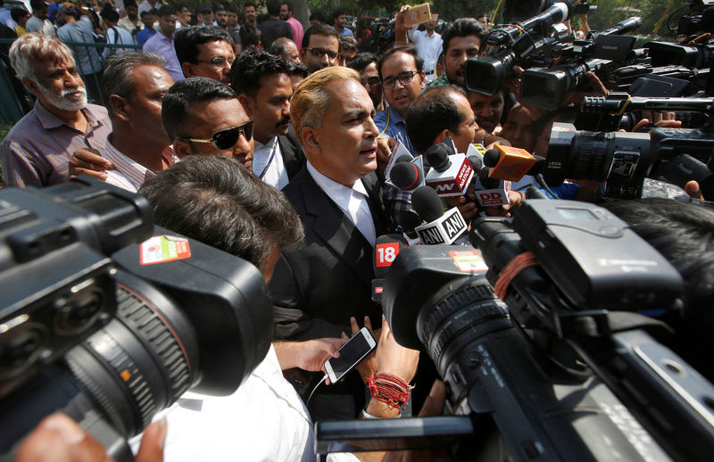 © Reuters. A.P. Singh, a lawyer representing three of the four men convicted of raping and murdering a 23-year-old trainee physiotherapist in 2012, talks to media after the court hearing in New Delhi