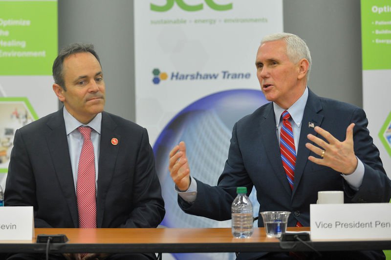 © Reuters. FILE PHOTO: U.S. Vice President Mike Pence sitting with Kentucky Governor Matt Bevin discusses the American Health Care Act  in Louisville