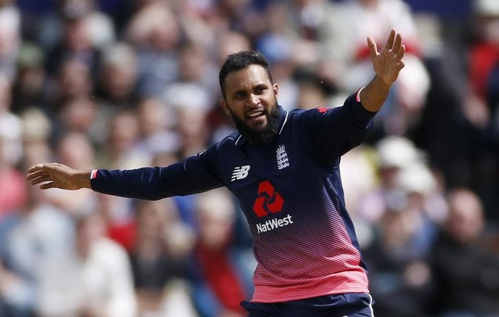 © Reuters. England's Adil Rashid celebrates the wicket of Ireland's Kevin O'Brien