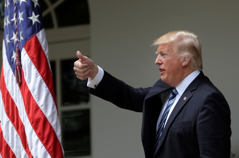 © Reuters. U.S. President Donald Trump gives a thumbs up during a National Day of Prayer event at the Rose Garden of the White House in Washington D.C.