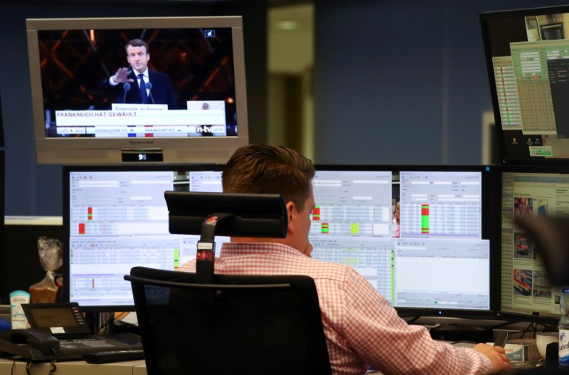 © Reuters. FILE PHOTO: A trader works at the stock exchange in Frankfurt