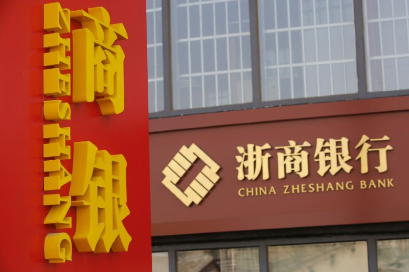 © Reuters. FILE PHOTO: A signboard of China Zheshang Bank is seen at its branch in Beijing