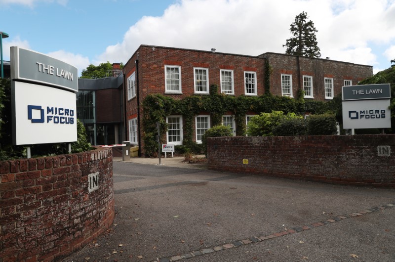 © Reuters. Signs stand outside the offices of Micro Focus in Newbury