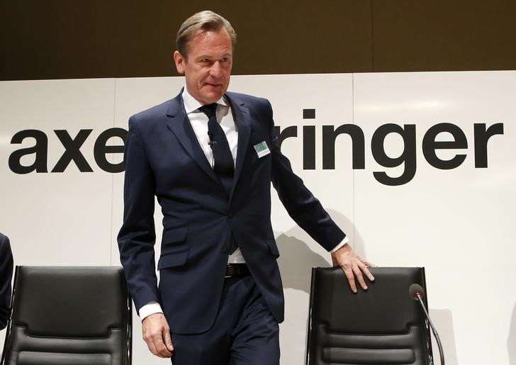 © Reuters. Doepfner, CEO of German publisher Axel Springer, arrives for the company's annual shareholders meeting in Berlin