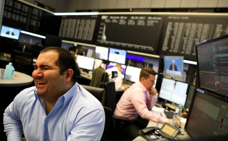 © Reuters. FILE PHOTO: A trader at the Frankfurt stock exchange reacts on morning trading results in Frankfurt