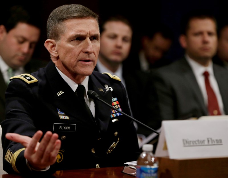 © Reuters. FILE PHOTO: Flynn testifying before House Intelligence Committee in Washington