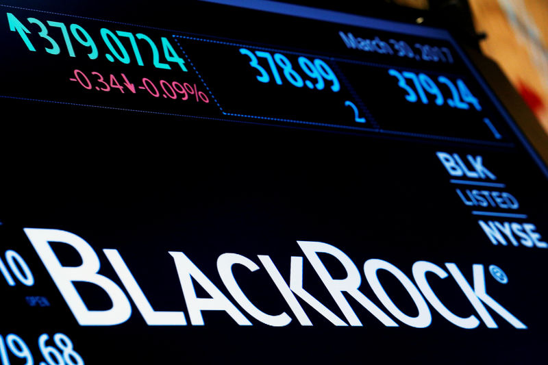 © Reuters. FILE PHOTO: The company logo and trading information for BlackRock is displayed on a screen on the floor of the NYSE