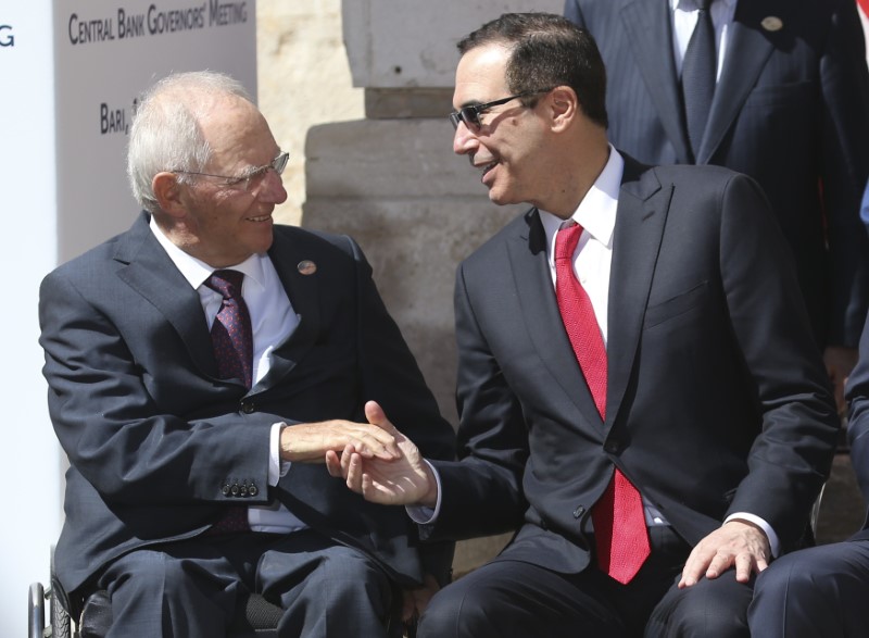 © Reuters. German Finance Minister Schaeuble shakes hands with U.S. Secretary of the Treasury Mnuchin during the G7 for Financial ministers meeting in the southern Italian city of Bari