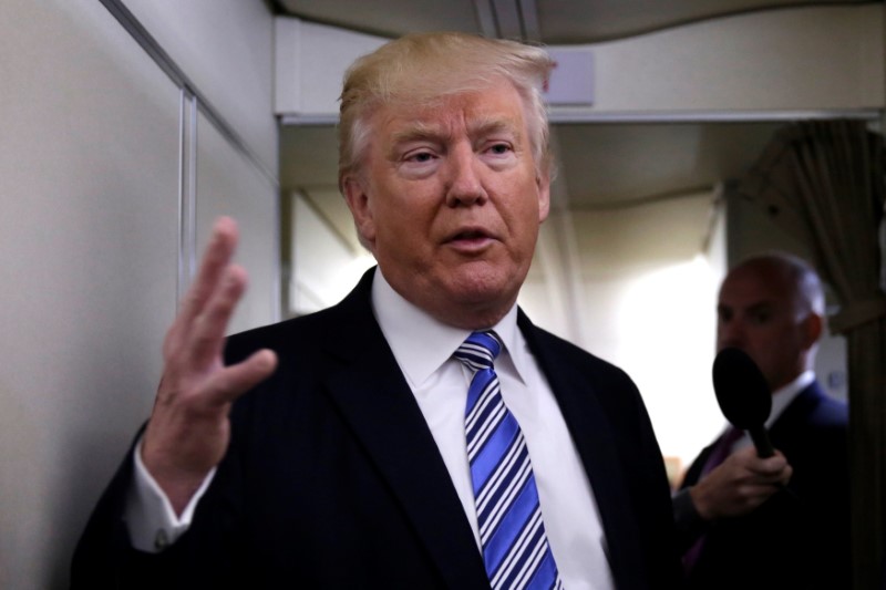 © Reuters. U.S. President Donald Trump talks to the media on board of Air Force One at Joint Base Andrews in Prince George's County