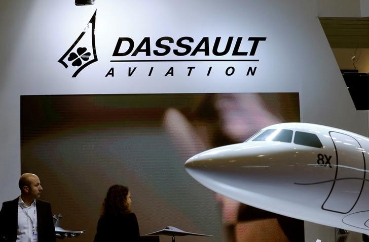 © Reuters. FILE PHOTO: A Dassault Aviation logo is pictured on the company booth during the European Business Aviation Convention & Exhibition (EBACE) at Cointrin airport in Geneva
