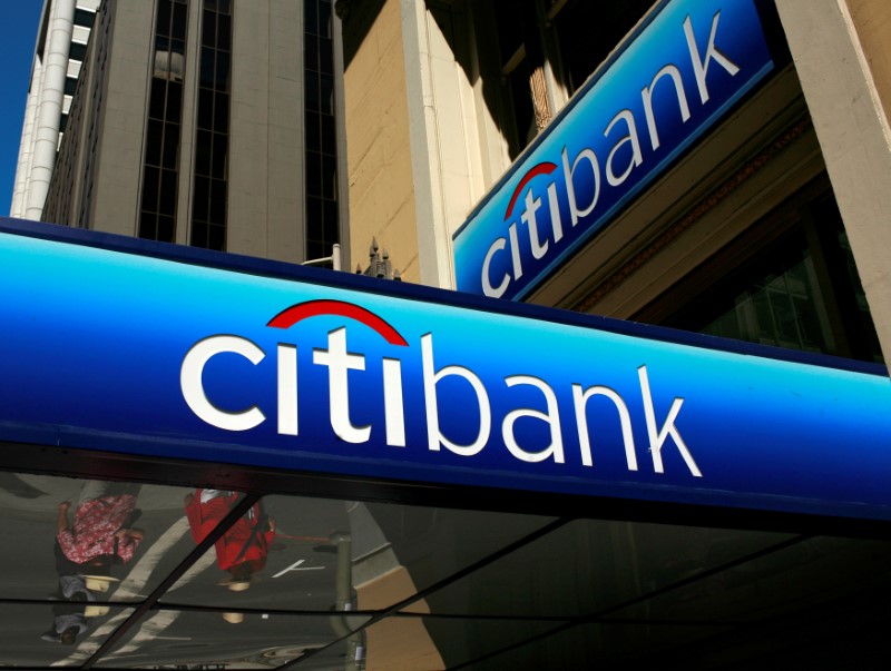 © Reuters. People walk beneath a Citibank branch logo in the financial district of San Francisco, California