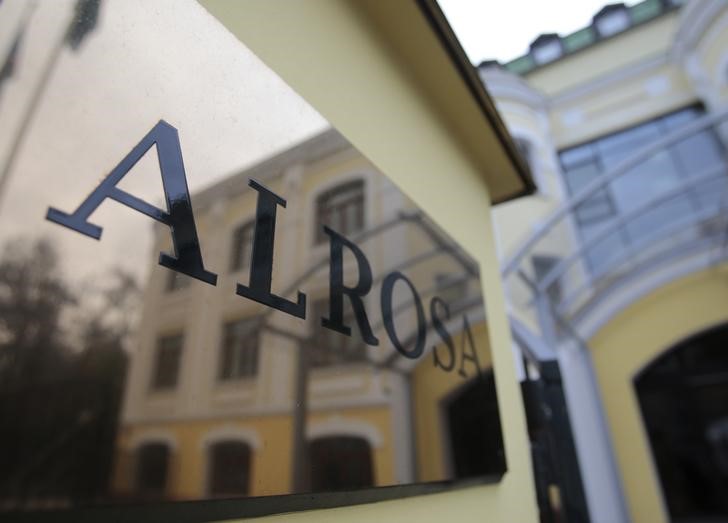 © Reuters. Moscow office of Russian diamond miner Alrosa is reflected in the company's name plate in central Moscow