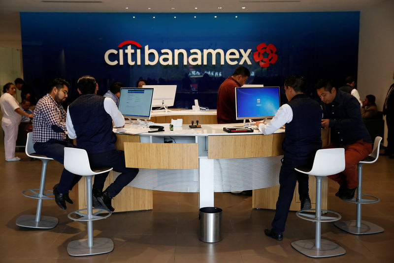 © Reuters. Personal bankers speak to customers inside a Citibanamex branch in Mexico City