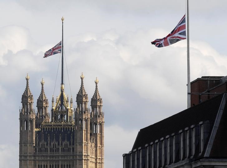 © Reuters. Union flags fly at half mast over Parliament and Whitehall in memory of the victims of the atack on Manchester Arena, in London