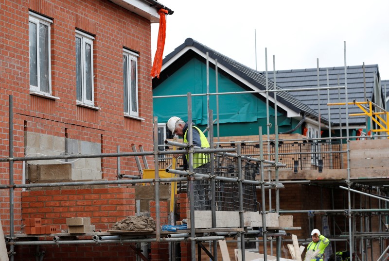 © Reuters. A Buildes constructs a modular Space4 home on a Persimmon development in Coventry