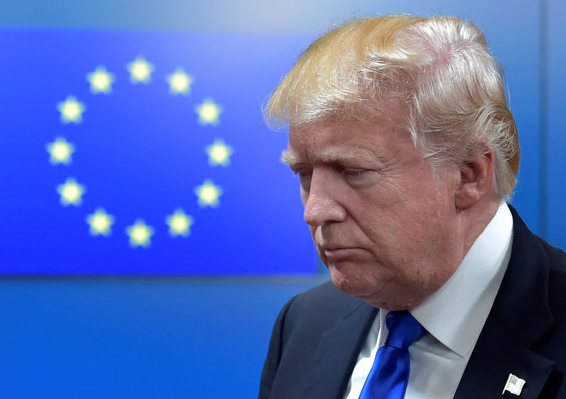 © Reuters. U.S. President Donald Trump reacts as walks with the President of the European Council Donald Tusk after a meeting in Brussels