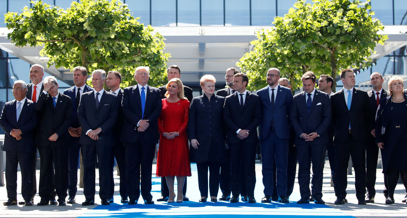 © Reuters. NATO member leaders pose for a family picture before the start of their summit at the new headquarters in Brussels