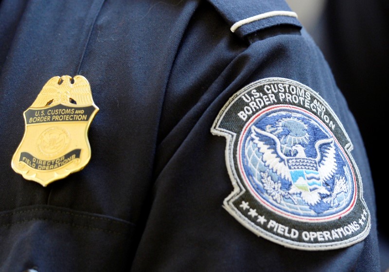 © Reuters. FILE PHOTO: A U.S. Customs and Border Protection arm patch and badge is seen at Los Angeles International Airport