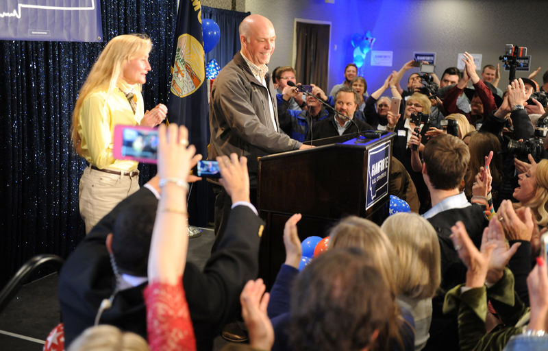 © Reuters. Representative elect Greg Gianforte stands on the stage in Bozeman