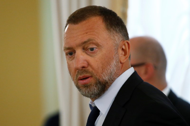 © Reuters. Rusal President Deripaska looks on before meeting of Russian President Putin and Turkish President Erdogan with Russian and Turkish entrepreneurs in St. Petersburg