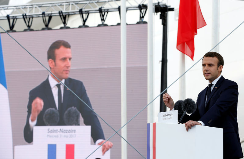 © Reuters. French President Macron attends a christening ceremony during a visit at the STX Les Chantiers de l'Atlantique shipyard site in Saint-Nazaire