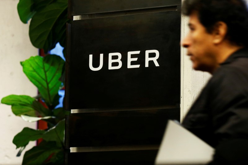 © Reuters. FILE PHOTO: A man exits the Uber offices in Queens, New York