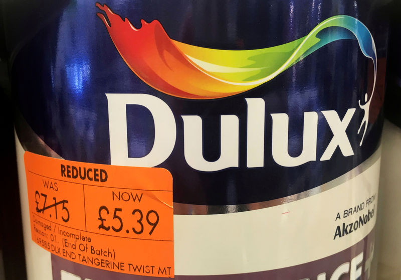 © Reuters. FILE PHOTO: Cans of Dulux paint, an Akzo Nobel brand, are seen on the shelves of a hardware store near Manchester, Britain.