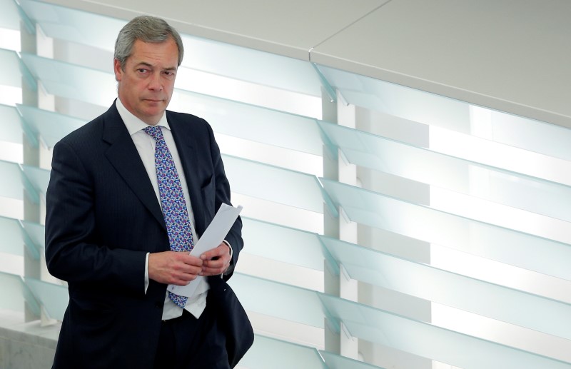 © Reuters. Farage,UKIP member and MEP arrives for to take part in a voting session at the European Parliament in Strasbourg