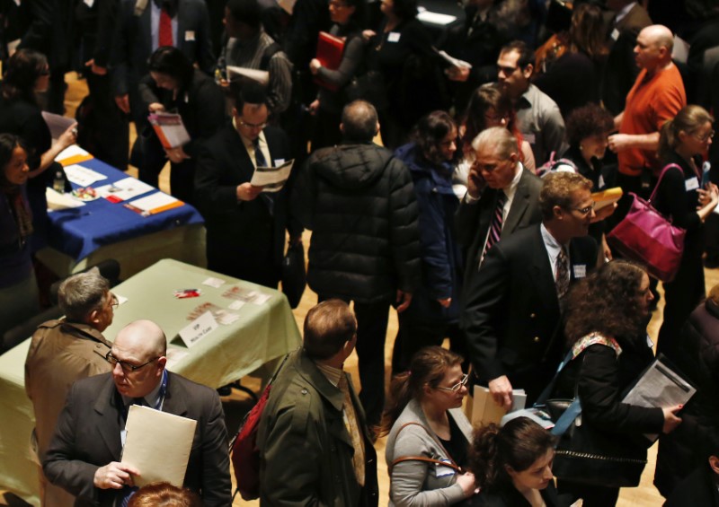 © Reuters. People wait in line to meet a job recruiter at the UJA-Federation Connect to Care job fair in New York