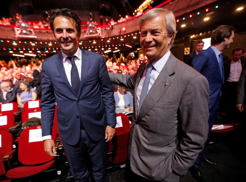 © Reuters. Vincent Bollore, Chairman of media group Vivendi and his son Yannick Bollore, Chairman and CEO of Havas Group, attend the company's shareholders meeting in Paris
