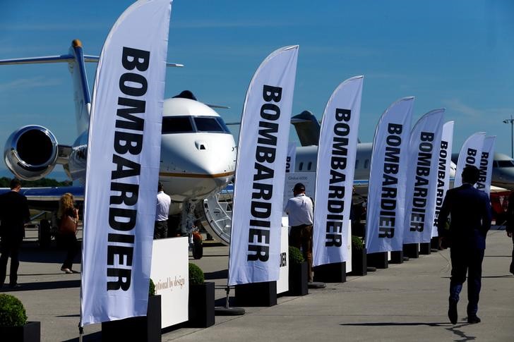 © Reuters. People attend the Bombardier stand during EBACE in Geneva