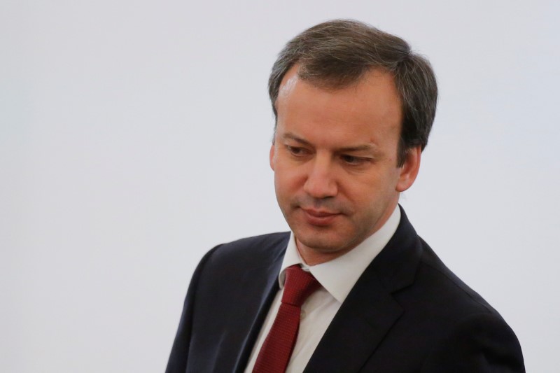 © Reuters. Russian Deputy PM Dvorkovich waits before annual state of nation address attended by Russian President Putin at Kremlin in Moscow