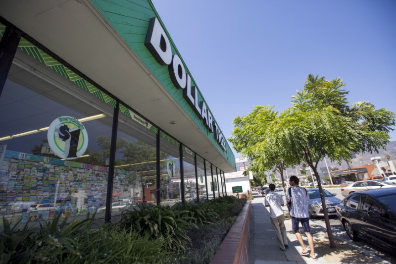 © Reuters. People walk by a Dollar Tree store in Pasadena