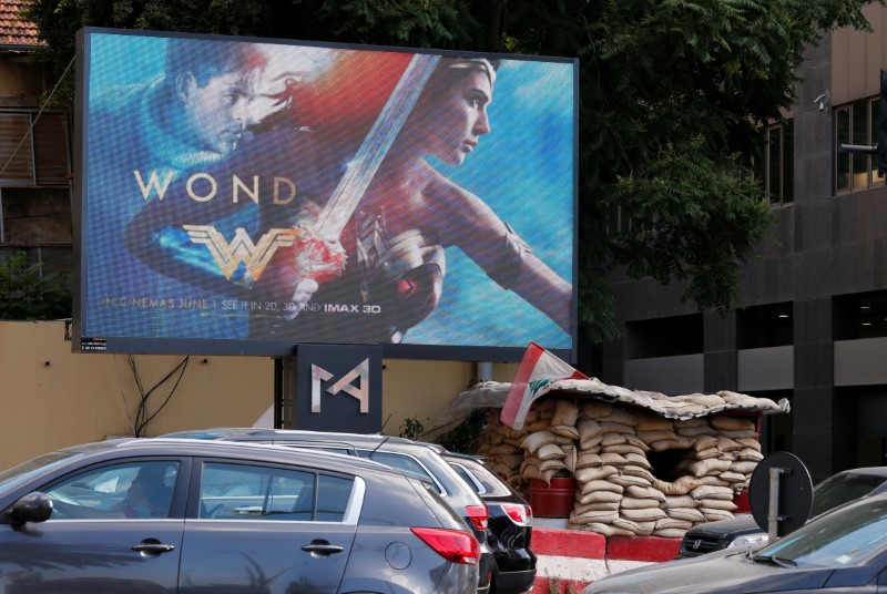 © Reuters. An advertisement of "Wonder Woman" movie is pictured near an army post in Beirut