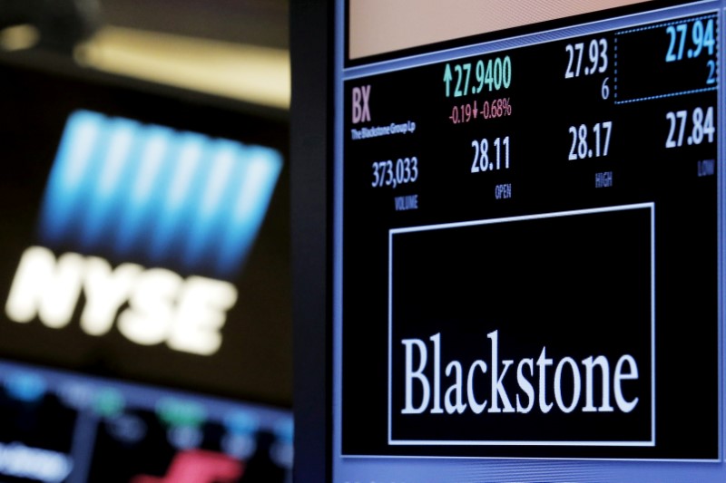 © Reuters. FILE PHOTO -  The ticker and trading information for Blackstone Group is displayed at the post where it is traded on the floor of the New York Stock Exchange