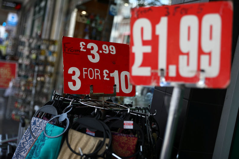 © Reuters. Prices are displayed on a store window in London