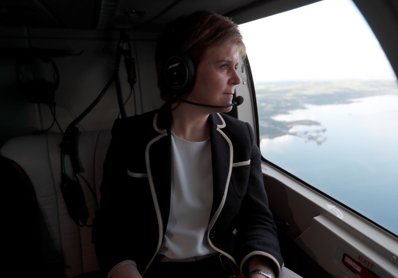 © Reuters. Nicola Sturgeon, First Minister of Scotland, looks out of the window of a helicopter as she crosses the Firth of Forth during a campaign trip in Scotland