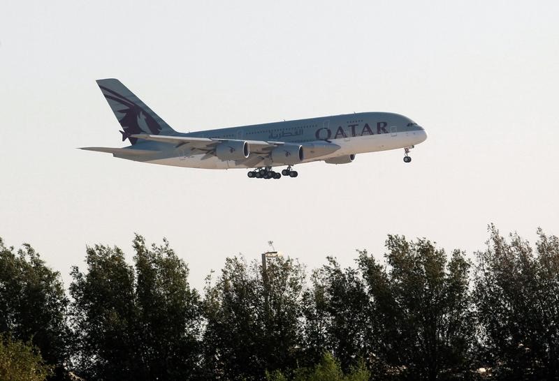 © Reuters. Qatar Airways plane is seen over Doha