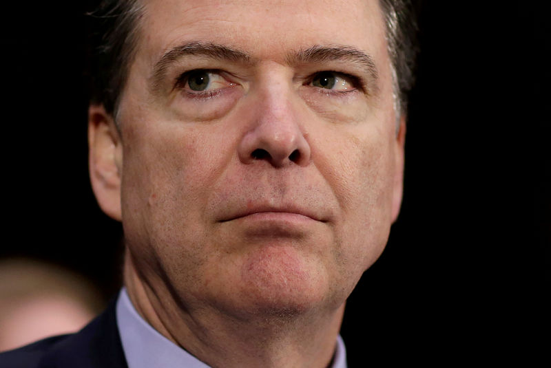 © Reuters. FILE PHOTO  - FBI Director James Comey waits to testify to the Senate Select Committee on Intelligence hearing on 