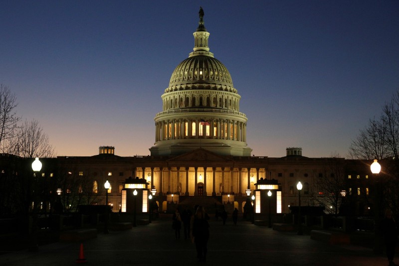 © Reuters. The U.S. Capitol Building is lit at sunset in Washington