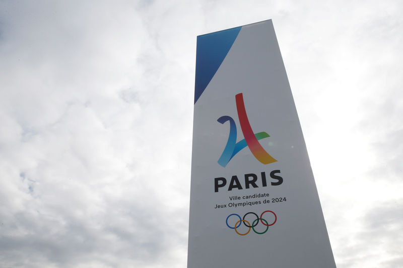 © Reuters. FILE PHOTO: The logo of the Paris candidacy for the 2024 Olympic and Paralympic Games is seen at the entrance of the Le Bourget exhibition center, site of the proposed media village and the press center, during the press tour of the International Olympic Committee Eva