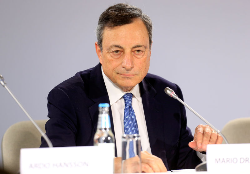 © Reuters. European Central Bank President Draghi listens during a news conference in Tallinn