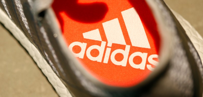 © Reuters. Adidas logo is pictured inside a shoe before company annual general meeting in Fuerth