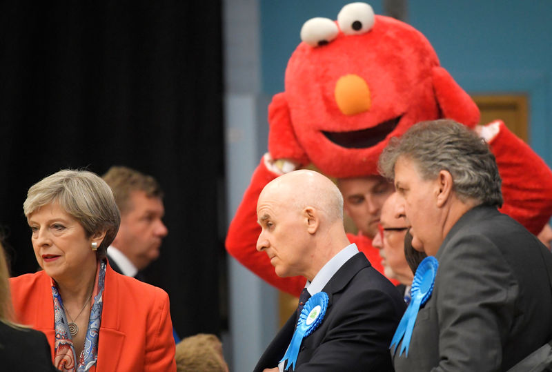 © Reuters. Britain's Prime Minister Theresa May waits for the result of the vote in her constituency at the count centre for the general election in Maidenhead,