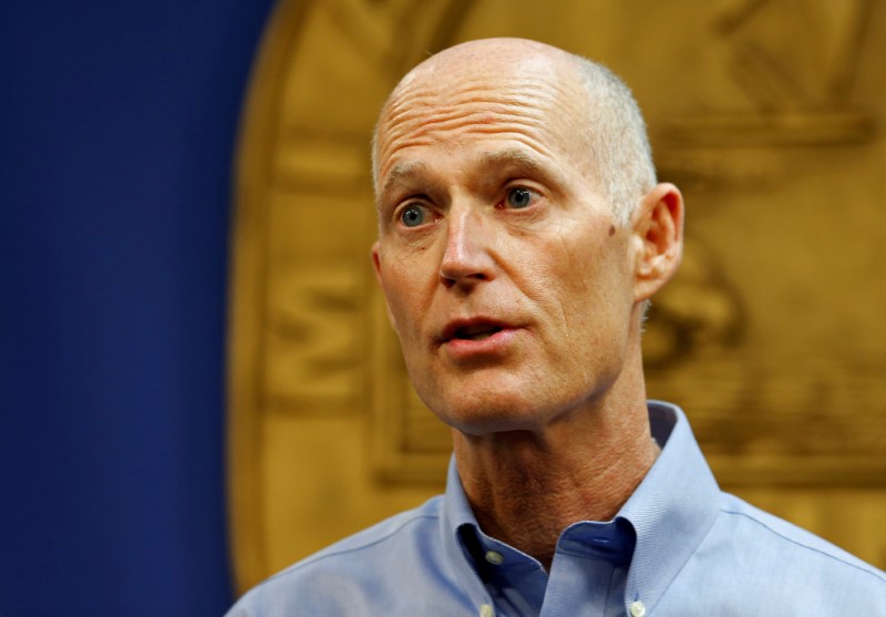 © Reuters. FILE PHOTO - Florida Gov. Rick Scott speaks at a press conference about the Zika virus in Doral